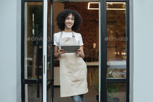 Small business owner or barista meets clients and accepts orders online