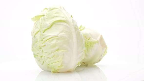 Haft Cabbage and cabbage rotation isolated on white background, Close up. alt