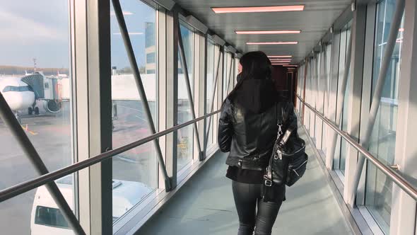 Stylish Woman Traveler Goes To the Airport After Landing the Plane alt