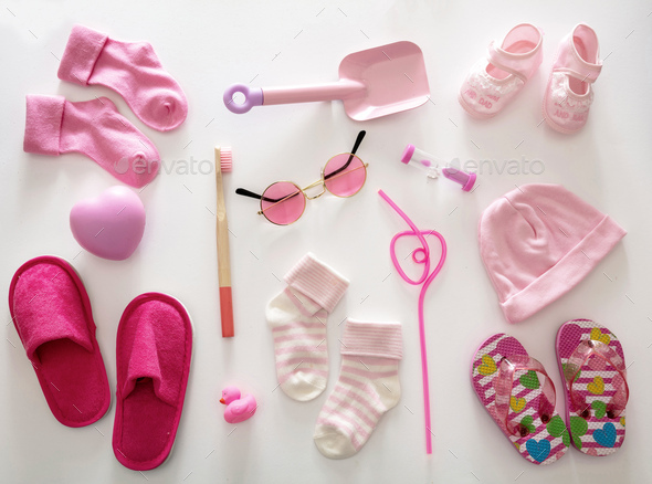 Baby girl pink color accessories on white background, top view. - Stock Photo - Images