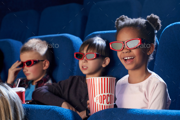 Happy Child In 3d Glasses Watching Comical Movie In Cinema Stock Photo By Serhiibobyk