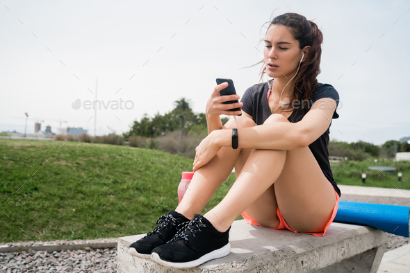 Athletic woman using her phone.