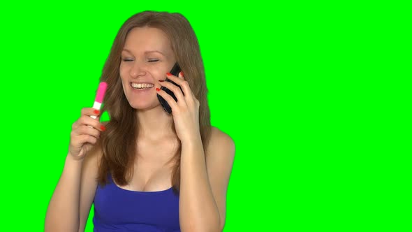 Beautiful Girl with Pregnancy Test Talking on Cell Phone