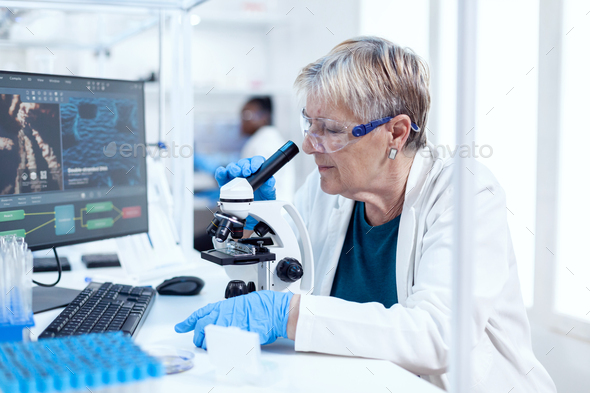 Senior scientist analysing sample of genetic material