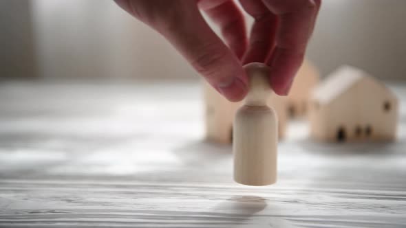 Father coming home after work with wife and children waiting in front of house together alt