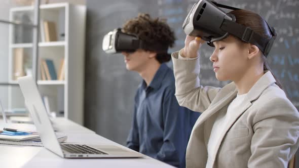 Students Using VR Glasses At Class alt