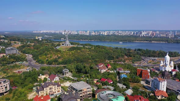 Capital of Ukraine - Kyiv city. Top view of cityscape, blue Dnipro. alt
