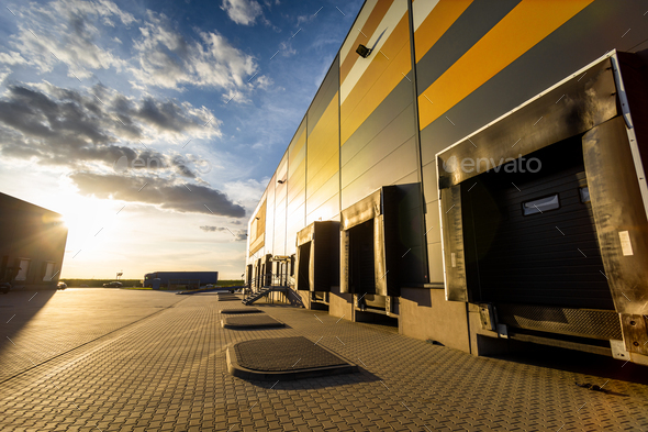 Cargo loading dock doors of big warehouse building, outdoor - Stock Photo - Images