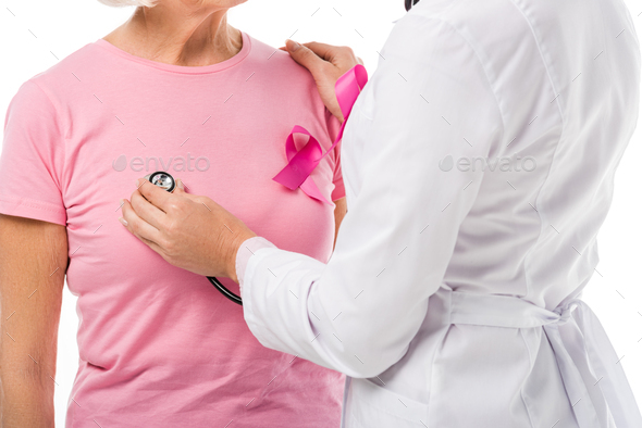 cropped shot of doctor with stethoscope checking health of senior woman with breast cancer awareness