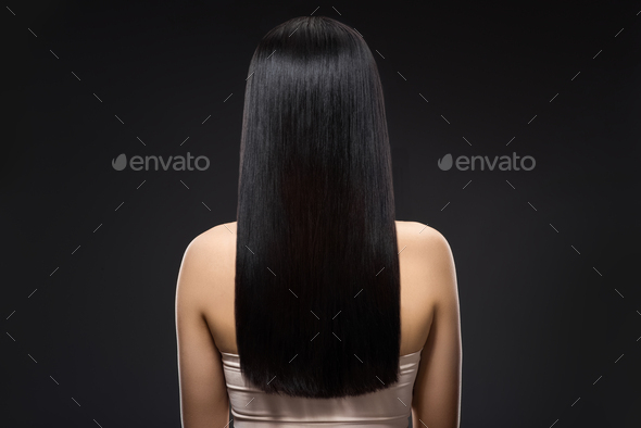 back view of woman with beautiful shiny hair isolated on black Stock Photo  by LightFieldStudios