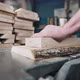 Closeup of Hands and Wood Workpiece on Planer - VideoHive Item for Sale