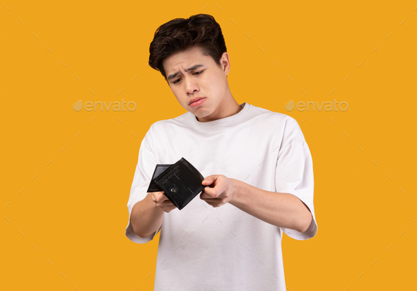 Portrait of asian man showing his empty wallet