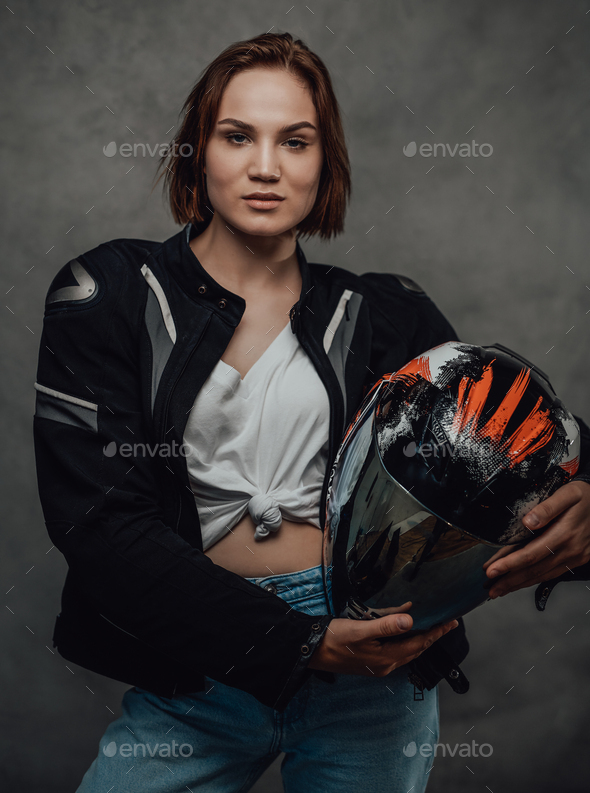 Glamour girl in white shirt with helmet poses in gray background Stock  Photo by fxquadro