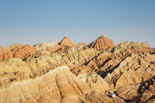 beautiful hilly landscape and bus in zhangye - Stock Photo - Images