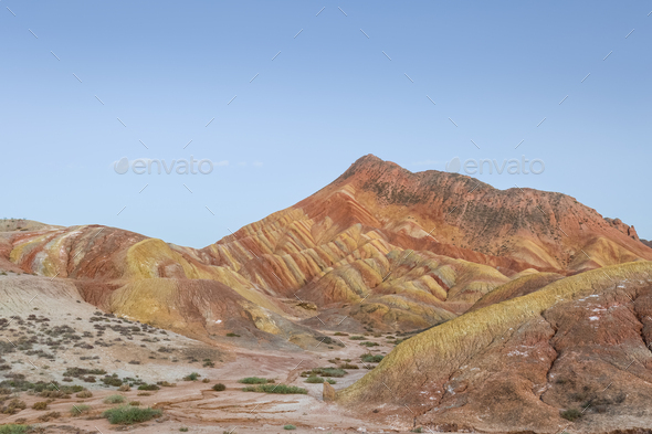 rainbow hilly landscape in twilight - Stock Photo - Images