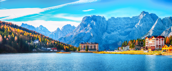 Fantastic sunny view of famous Misurina lake during autumn period Stock Photo by Pilat666