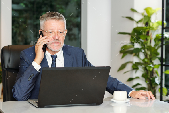 Angry entrepreneur talking on phone