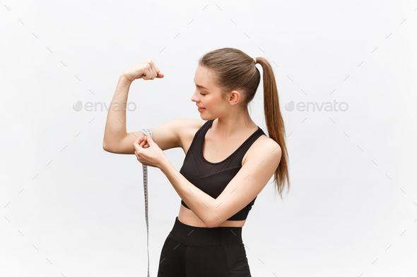 Happy slim woman with measuring tape on color background. Positive weight loss diet results
