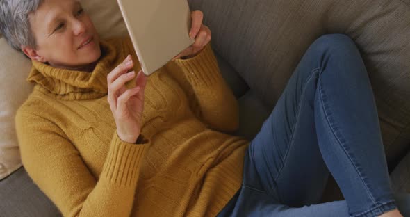 Senior woman at home alone alt