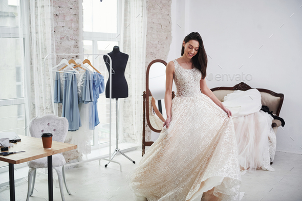 It\'s so long. The process of fitting the dress in the studio of hand crafted clothes