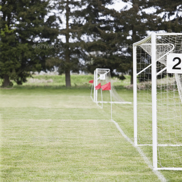 Soccer goal nets on soccer field. Stock Photo by Mint_Images PhotoDune