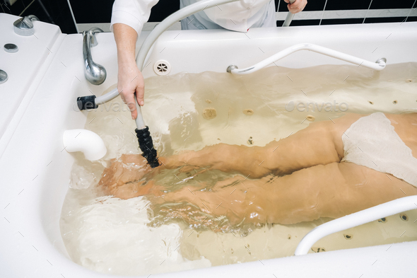 the procedure of underwater shower massage in the sanatorium.Girl on the procedure of underwater