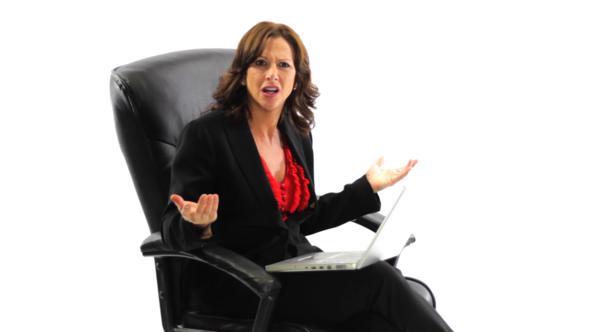 Confused Businesswoman With Laptop