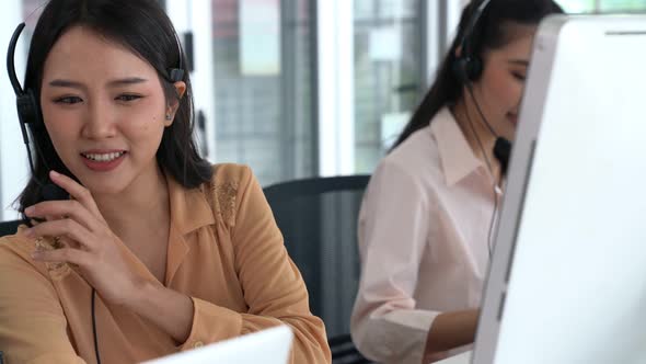 Business People Wearing Headset Working Actively in Office alt