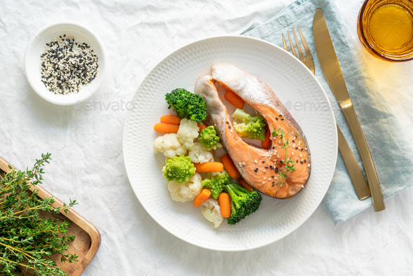 Steam salmon and vegetables, top view. Paleo, keto, fodmap, dash diet