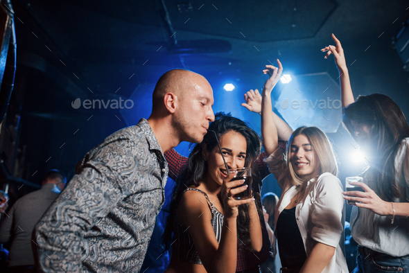 Beautiful youth have party together with alcohol in the nightclub