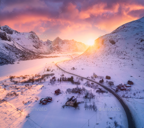 Beautiful road in snowy mountains in winter at sunset Stock Photo by  den-belitsky
