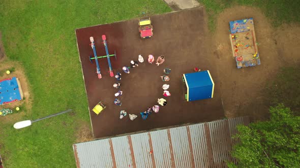 Children Play on the Playground in Kindergarten in Summer Aerial View