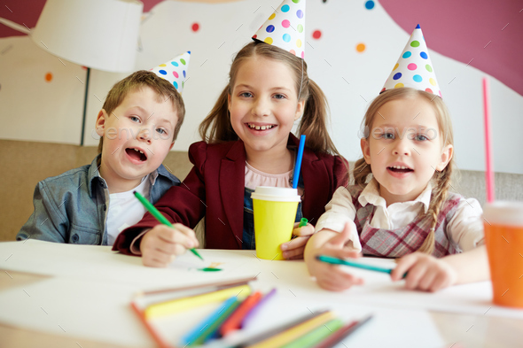 Enjoying birthday party Stock Photo by Pressmaster | PhotoDune