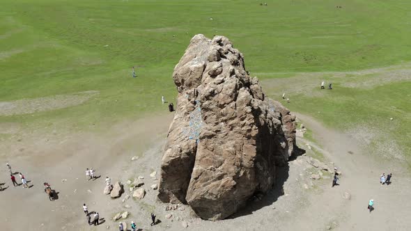 Tourists Religious Symbol Taikhar Chuluu Rock in Arkhangai Aimag, Mongolia alt