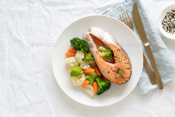 Steam salmon and vegetables, top view, copy space. Paleo, keto, fodmap, dash diet