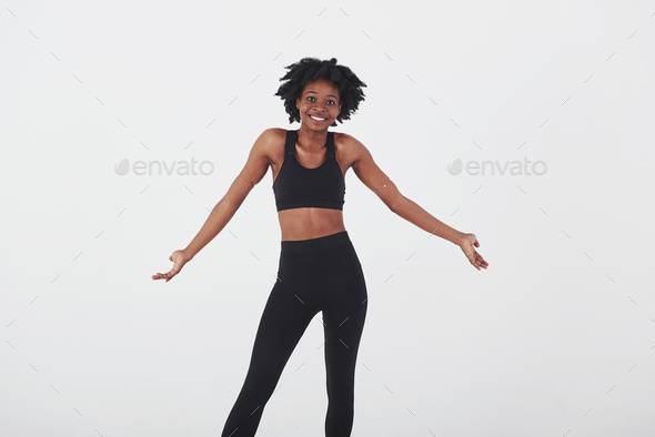 What I can do, gesture. Young beautiful afro american woman in the studio against white background