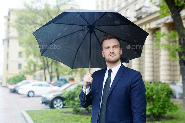 Man in the rain Stock Photo by Pressmaster | PhotoDune