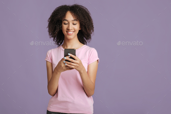 Texting message and modern blog. Smiling lady holding smartphone