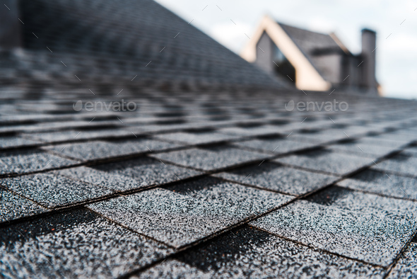 selective focus of grey shingles on rooftop of building - Stock Photo - Images