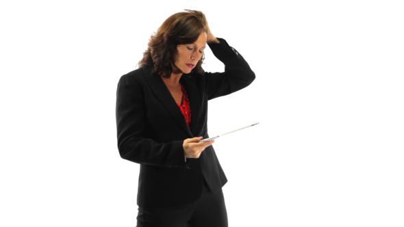 Confused Businesswoman Using A Tablet