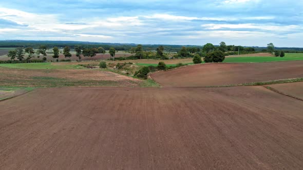 Aerial view of polish countryside meadow shot in Kaszuby, pomorskie in Poland. alt