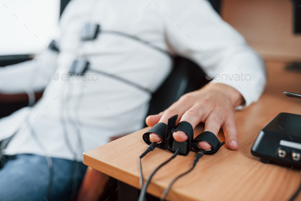 Suspicious Man Passes Lie Detector In The Office Asking Questions Polygraph Test Stock Photo By Mstandret