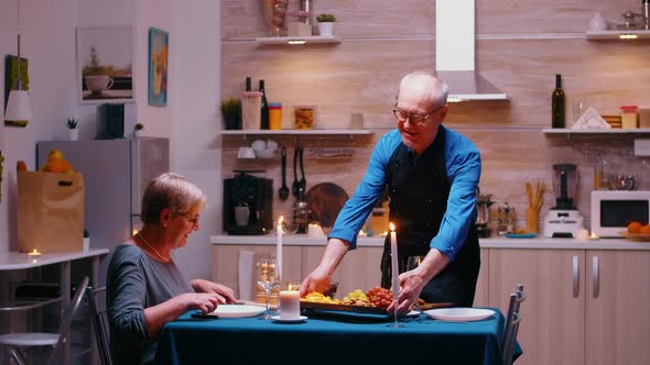 Retirement Man Surving Dinner alt