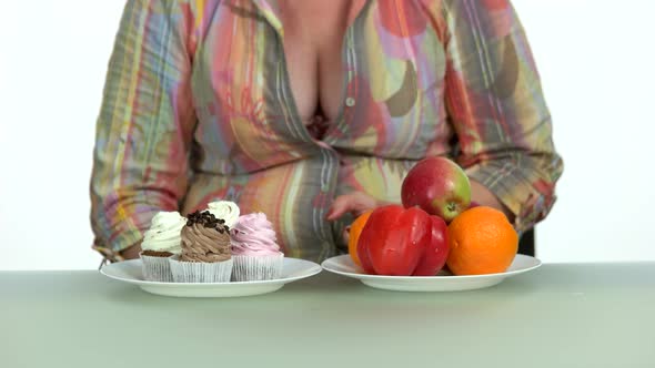 Woman Deciding Between Healthy and Unhealthy Food alt