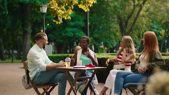 In the Middle of the Park at the Cafe Black Woman alt