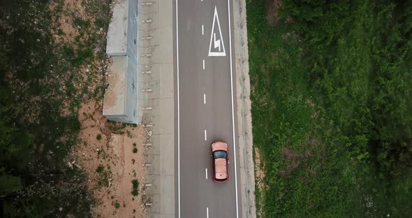 Drone Point of View Tracking Mode Aerial View Flying Over Two Lane Countryside Forest Road with alt