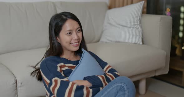 Woman watch tv at home alt