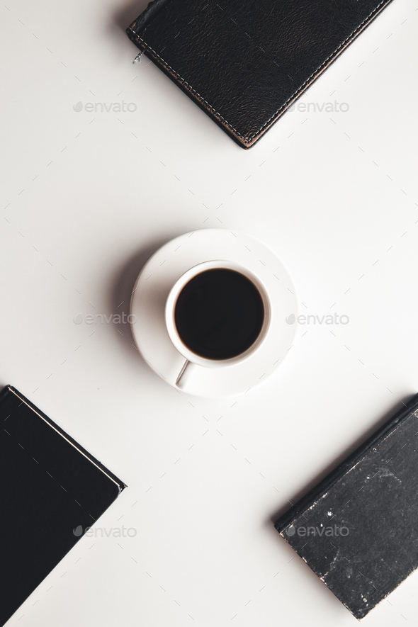 Office desk table with supplies, coffee cup and flower. Top view - Stock Photo - Images
