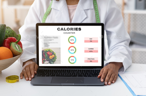 Black Dietologist Female Doctor Demonstrating Laptop With Calories Counter Program Website