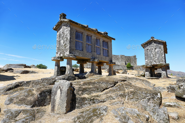 Typical stone corn driers, called Espigueiros in Lindoso, north of Portugal - Stock Photo - Images